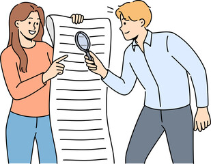 Man and woman are studying business document using magnifying glass to look for hidden information
