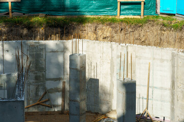 Building foundation construction. Monolithic concrete and reinforced concrete structures on the...
