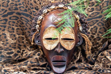 Wooden tribal African mask from Uganda, for family or personal protection, made of local wood,...