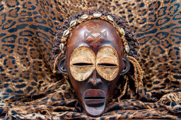 Wooden tribal African mask from Uganda, for family or personal protection, made of local wood,...