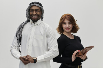 Arabic entrepreneur and a businesswoman, exuding confidence and unity, pose together against a...