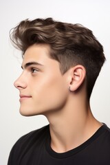 Fototapeta premium Beautiful model boy-man in a plain white studio, softly light. Suitable for diverse commercial projects