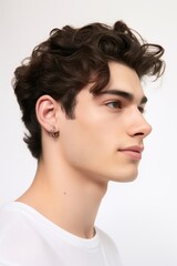 Beautiful model boy-man in a plain white studio, softly light. Suitable for diverse commercial projects