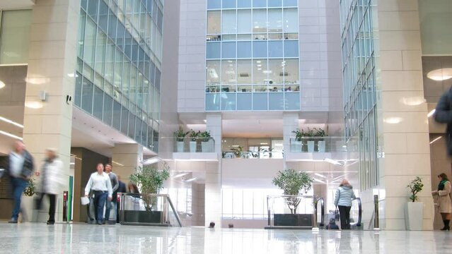 People walk in the lobby of business center Preo-8 (Preobrazhensky)