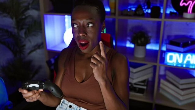 Black woman, numero uno in gaming, filled with exuberant joy - radiating pure confidence, she lights up the gaming room with a smart question, pointing finger up, eyes ablaze with a thrilling idea