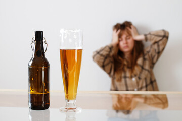 alcoholism, alcohol addiction and people concept - drunk woman or female alcoholic drinking at home