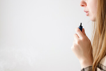 close up woman smoking vape, harm to health, smoking ban