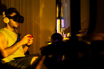 Content creator broadcasts his games playing console games on computer with virtual reality glasses...