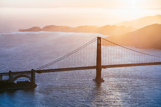 Aerial of Golden gate bridge and bay at sunset, San Francisco, USA