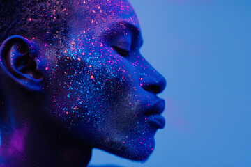 Profile of a Man Adorned with Cosmic Blue and Magenta Holi Paint