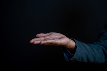 Businessman 's hand, fingers, conveying a powerful symbol of touch and connection in a conceptual image, future, big data, growth, Sustainability.