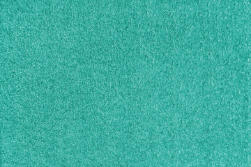 Texture background of turquoise fabric. Upholstery jacquard texture cloth, boucle furniture textile material, design interior, decor. Ridge fabric texture close up, backdrop, wallpaper.