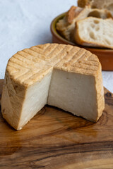 Cheese collection, piece of fresh smoked Spanish goat cheese close up