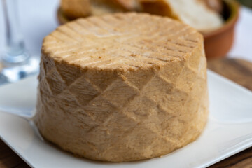 Cheese collection, piece of fresh smoked Spanish goat cheese close up