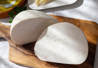 Fresh gauzed white soft goat cow sheep milk cheese, young Spanish cheese