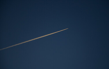 Airplane vapor trail in the sky