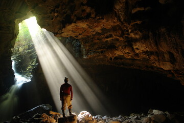 Man in a cave, in central Brazil