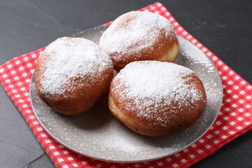 Delicious sweet buns on dark gray table, closeup