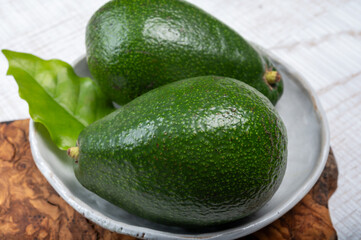 Green ripe avocado fruits from organic avocado plantation - healthy food