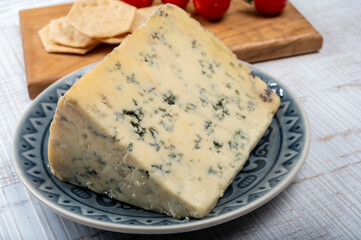 Cheese collection, English semi-soft, crumbly old stilton blue cheese close up