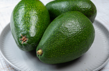 Green ripe avocado fruits from organic avocado plantation - healthy food
