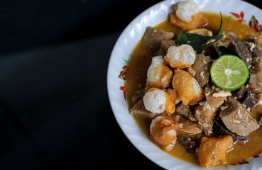 Traditional Indonesian food spicy and savory Seblak Jeletot, with toppings of wet crackers, meatballs, chicken, etc. Cooked with spicy sauce, from Sunda, West Java.