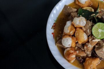 Traditional Indonesian food spicy and savory Seblak Jeletot, with toppings of wet crackers, meatballs, chicken, etc. Cooked with spicy sauce, from Sunda, West Java.