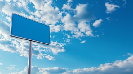 Blank blue traffic sign against blue sky background with white clouds. Mockup traffic sign with copy space. - obrazy, fototapety, plakaty