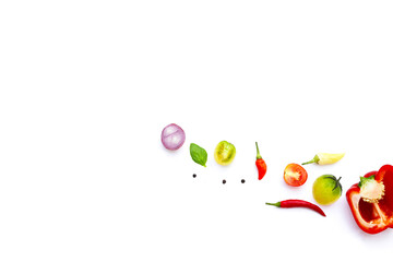 Various fresh vegetables and herbs on white background.