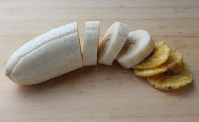 Sliced ​​banana and banana chips isolated.