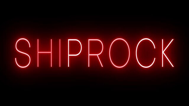 Flickering red retro style neon sign glowing against a black background for SHIPROCK