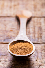 Splinters, powder and essence of cinnamon, on the old table