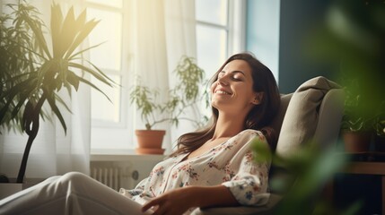 A Happy woman sitting in comfortable chair in home design, relaxing, breathing fresh air. A smiling young female tenant or a tenant relaxing in an armchair relieves negative emotions - obrazy, fototapety, plakaty