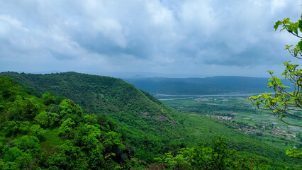 beautiful view of the mountain and rainy cloudy sky from the top of the avachitgad fort in...