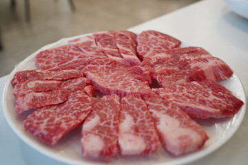 A plate of fresh beef is provided.