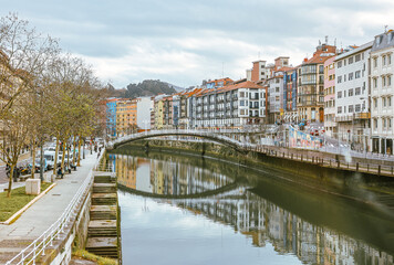 Bilbao, Spain - January 2, 2024: Architectural details of buildings along the Nervion River in Bilbao, Spain
