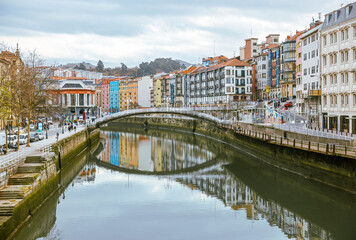 Fototapeta na wymiar Bilbao, Spain - January 2, 2024: Architectural details of buildings along the Nervion River in Bilbao, Spain 