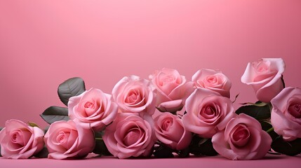 A lovely bouquet of delicate roses on a pink background with a place for text