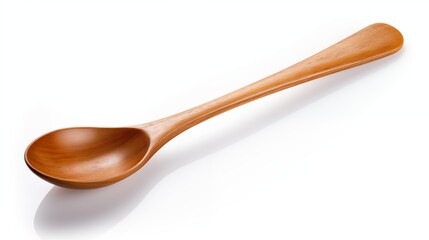 A wooden spoon resting on a white surface.
