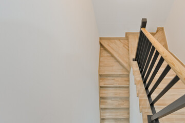 The stairs leading down to the basement have a bright and cheerful interior