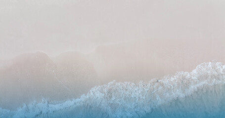 The soft wave water of the sea on the sandy beach background