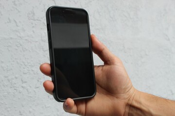 Hand holding mobile phone