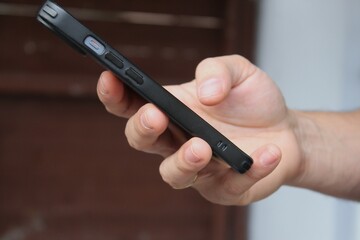 Hand holding mobile phone