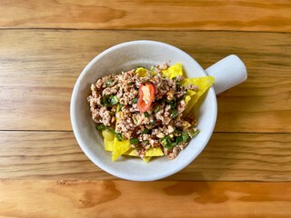 Spicy yum minced pork with crispy wonton, top view.