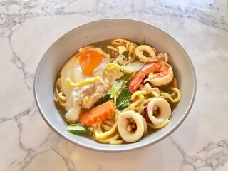 Seafood noodles, Hokkien Mee the famous Phuket local food. Selective focus