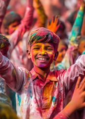 Naklejka premium A Potrait Happy Young Boy in a Joy and Vibrancy of Holi Festival Celebration