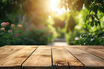 Naklejka na ściany i meble A wooden table with no objects on it and a blurred outdoor garden background. The wooden table provides space for text and can be used for marketing promotions