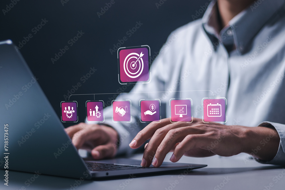 Poster targeting business concept. businessman use laptop with virtual target icon for business objective. 