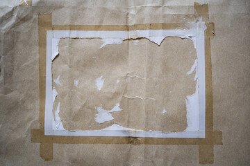 Peeled white paper on kraft paper envelope texture background
