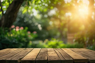 Fotobehang Photo wooden table and blurred green nature garden background with copy space © Cheetose